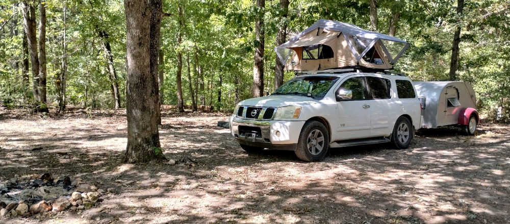 I cheat. Rooftop tent, teardrop camper with galley kitchen, truck has a full kitchen with refrigerator stove and oven, on-board water and shower, solar power, projector and screen 😆