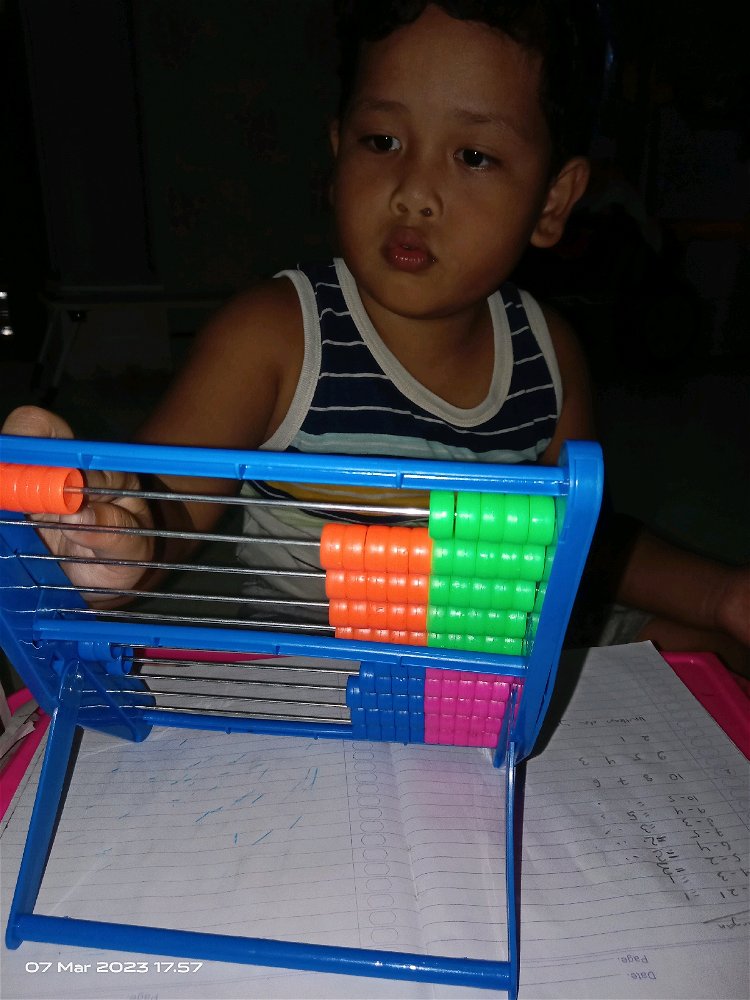 Teaching my son to do his review examination tomorrow