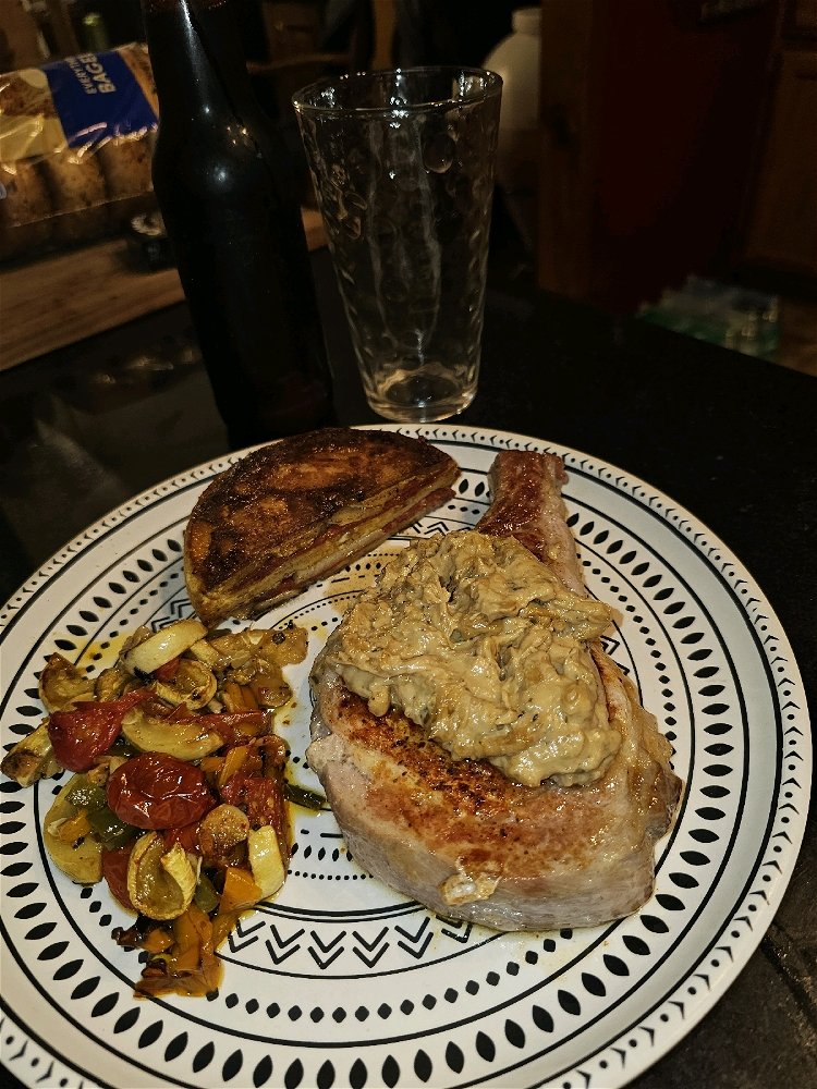 Bone in Pork Chop with Creamy Onion and Blue Cheese Gravy. Au Gratin Cake and Roasted Vegetables. Home Brewed Imperial Chocolate Stout.
