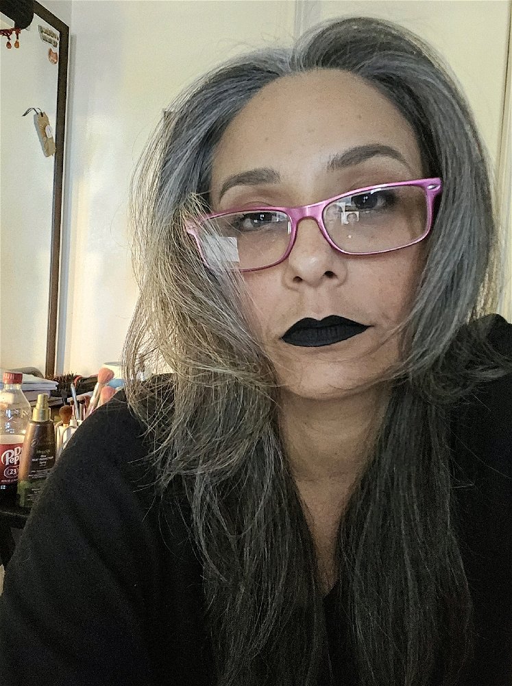 I tried smiling but the black lipstick was not having it. 