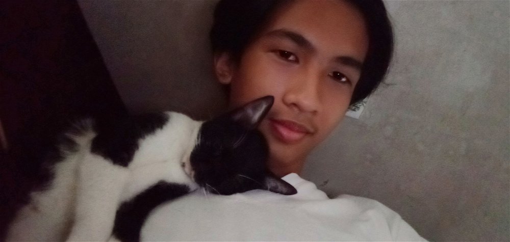 Another pic of my cat sleeping on top of me