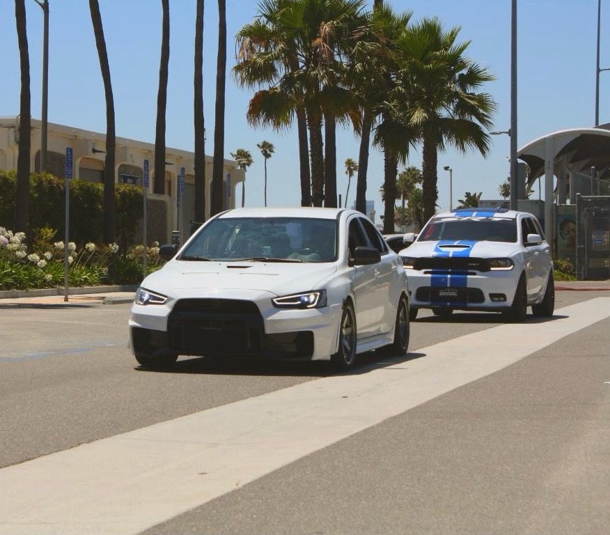 My Evo X pulling up to the meet w/ a Durango Hellcat 