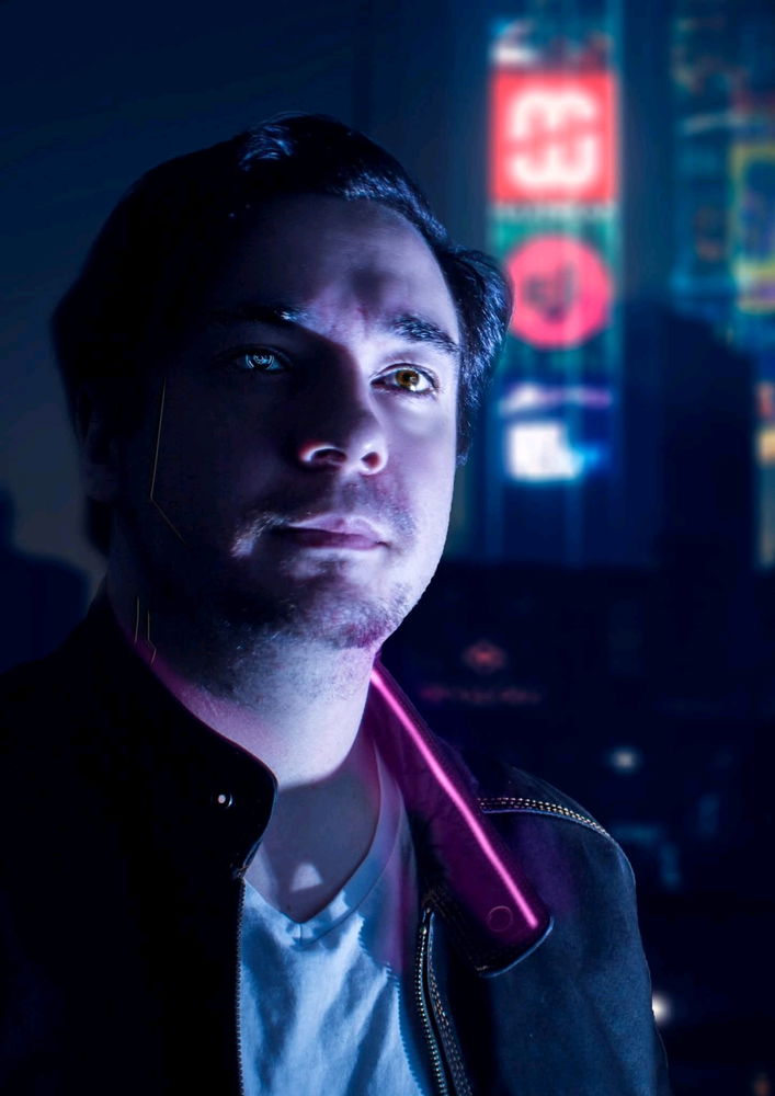 Old self portrait edit i did inspired by Cyberpunk 2077, might've pinched the background from the game too