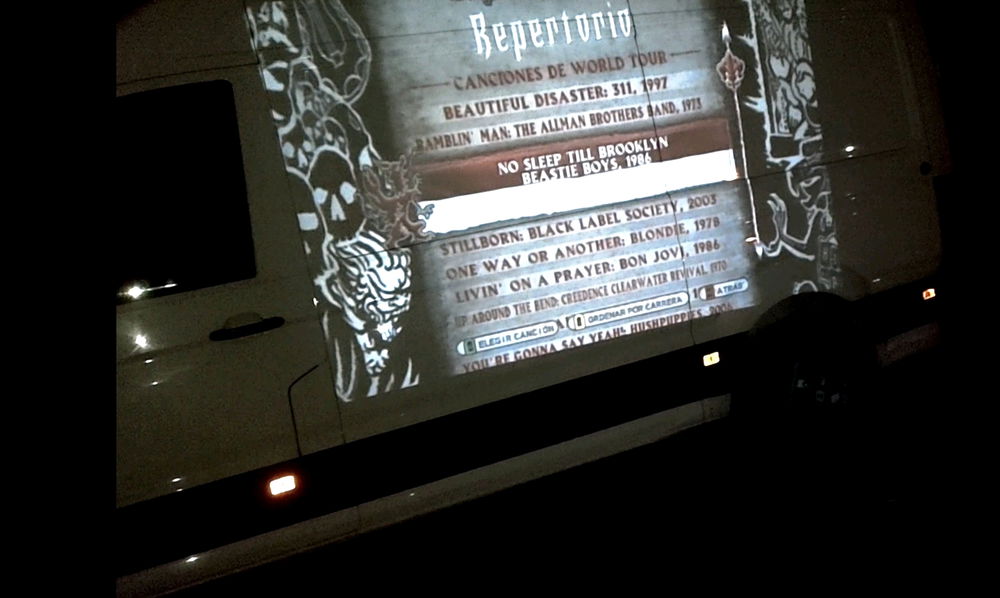 Van + projector + guitar hero