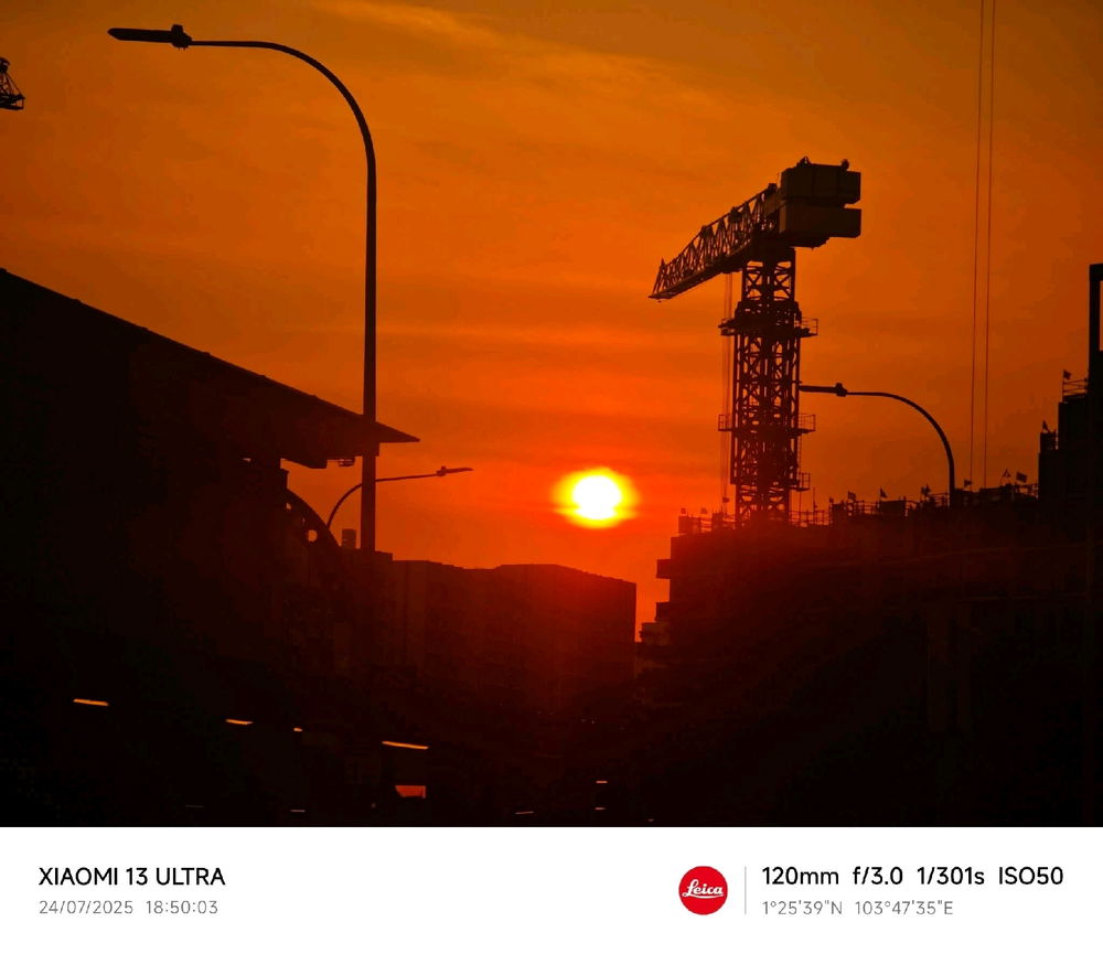 Lamp post. Sunset. Crane lift.