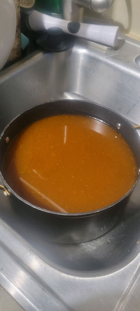 Strained beef bone broth.